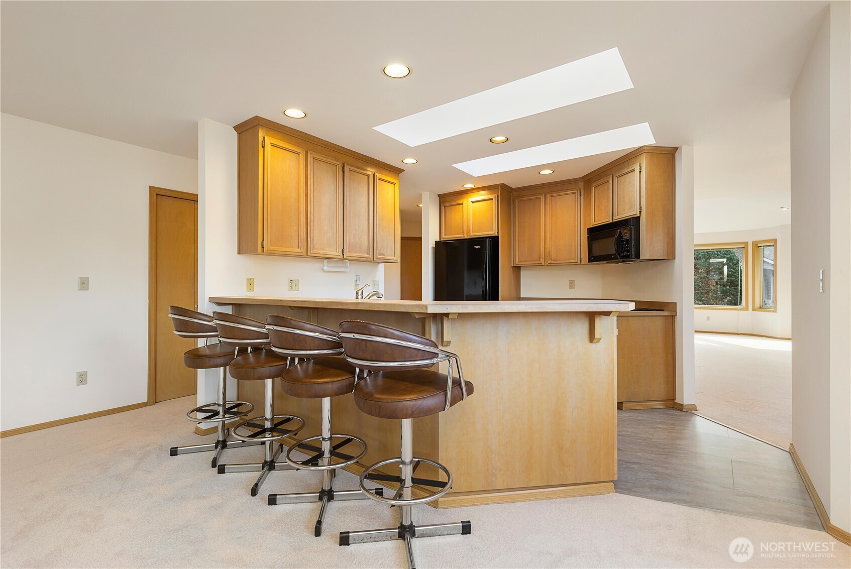 8523 199th Place Southwest Edmonds, WA 98026 - Photo 18 of 40 a view of kitchen with kitchen island dining table and chair