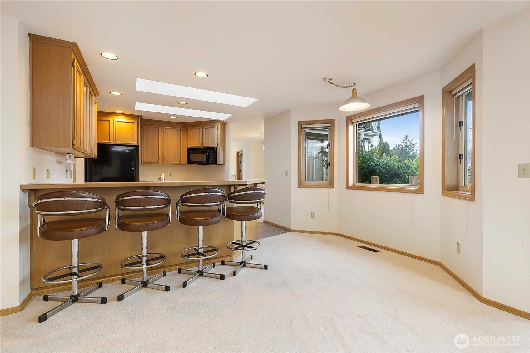 8523 199th Place Southwest Edmonds, WA 98026 - Photo 19 of 40 a view of a kitchen with kitchen island a counter top space appliances and a window