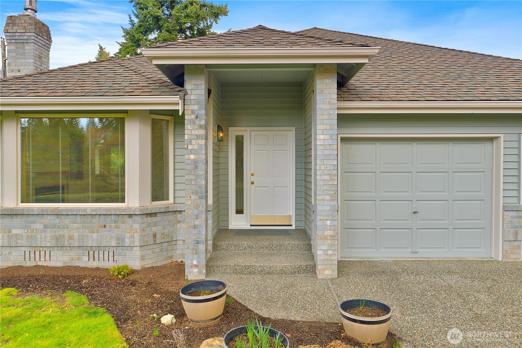 8523 199th Place Southwest Edmonds, WA 98026 - Photo 3 of 40 a front view of a house with a yard