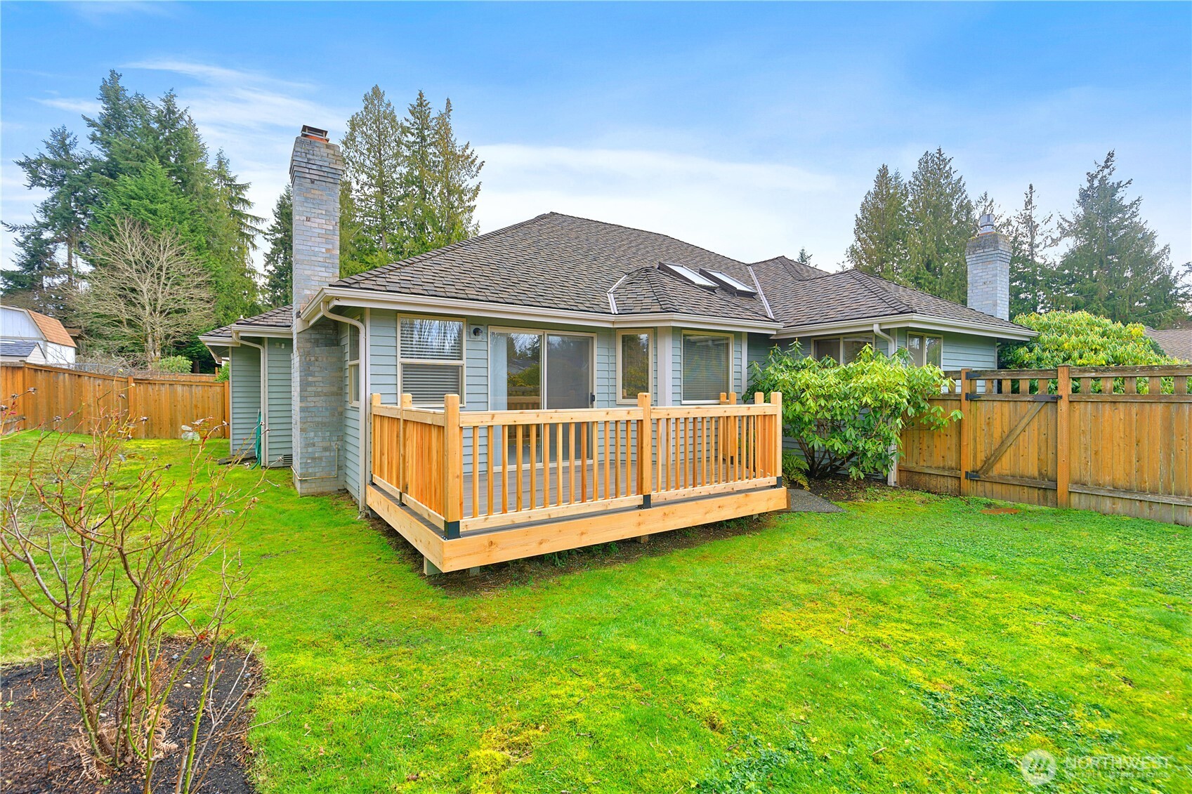 8523 199th Place Southwest Edmonds, WA 98026 - Photo 35 of 40 a view of a house with a yard and a wooden deck