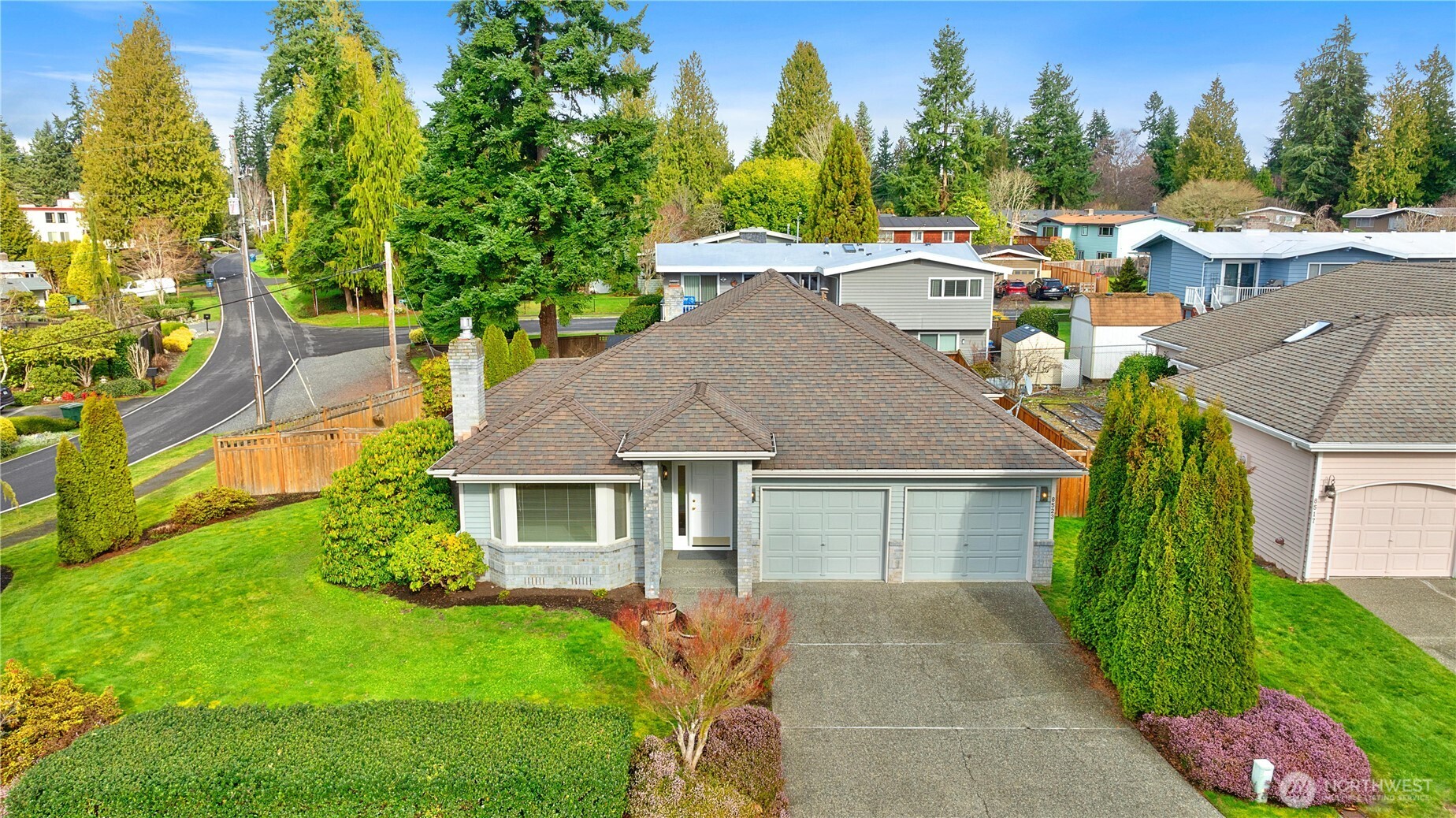 8523 199th Place Southwest Edmonds, WA 98026 - Photo 39 of 40 a aerial view of a house with a yard and trees
