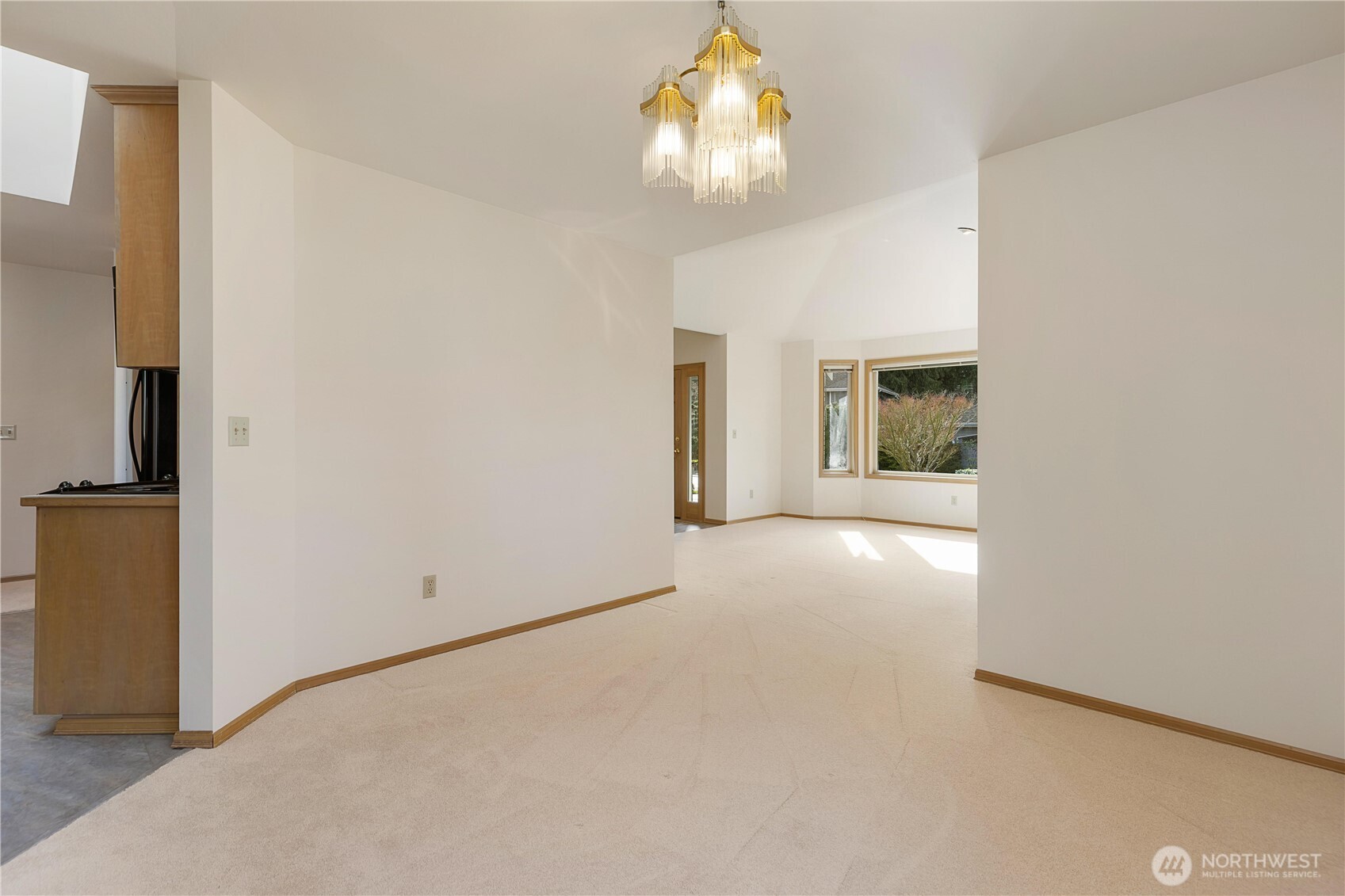 8523 199th Place Southwest Edmonds, WA 98026 - Photo 10 of 40 a view of an empty room with a chandelier fan
