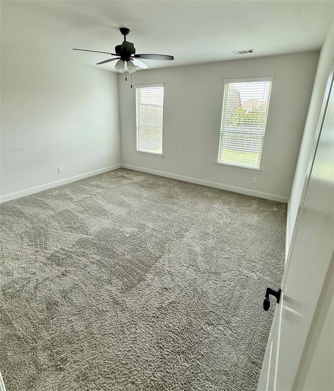 204 Flower Ridge Drive Fort Worth, TX 76108 - Photo 22 of 27 a view of a livingroom with a ceiling fan and window