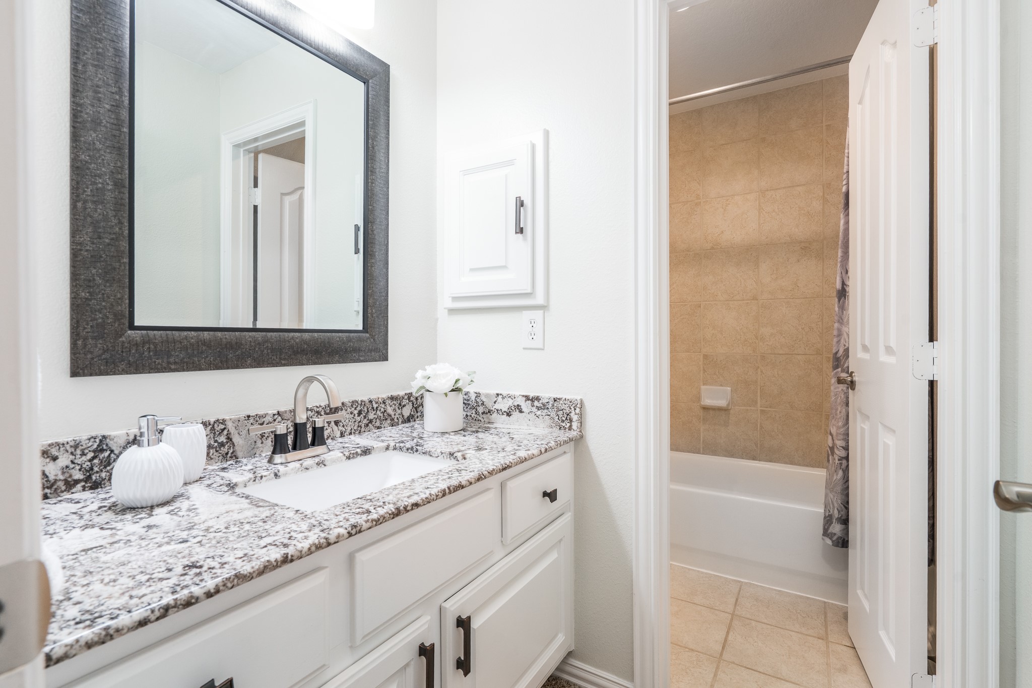 5914 Oakmoss Trail Spring, TX 77379 - Photo 28 of 50 Each secondary bedroom has its own sink/vanity space to keep those busy weekday mornings moving smoothly!