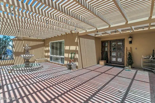 a view of a room with wooden floor