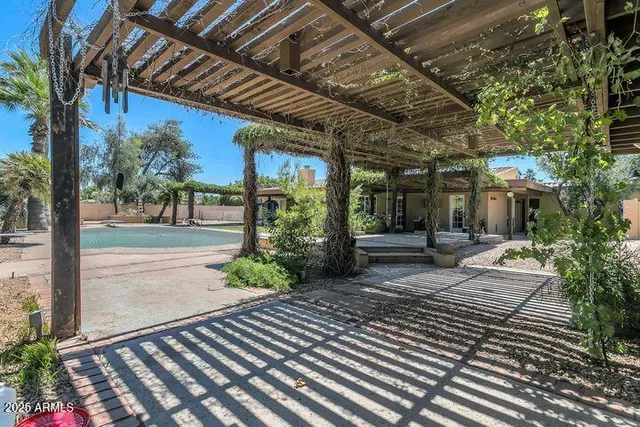 a view of backyard with sitting area