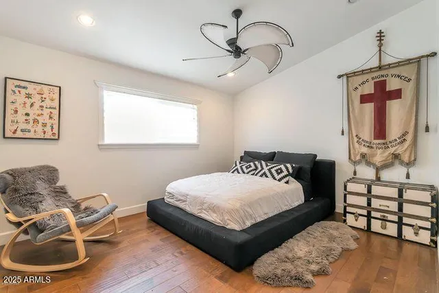 a bedroom with a bed window and couch