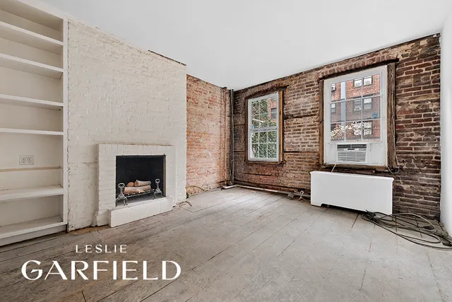 an entryway with wooden floor