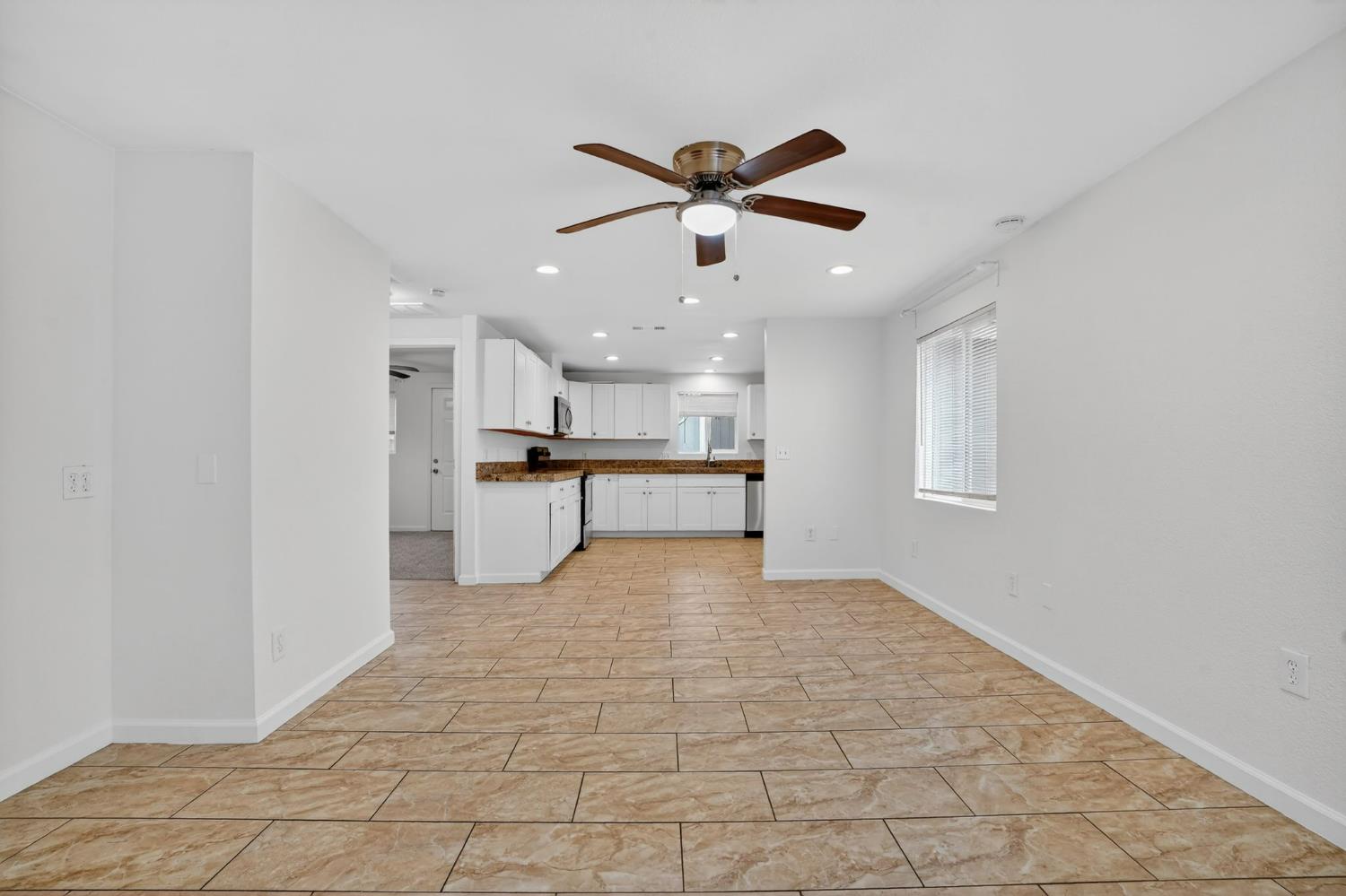 418 East Granger Avenue Modesto, CA 95350 - Photo 6 of 23 a view of kitchen with a sink stainless steel appliances and cabinets
