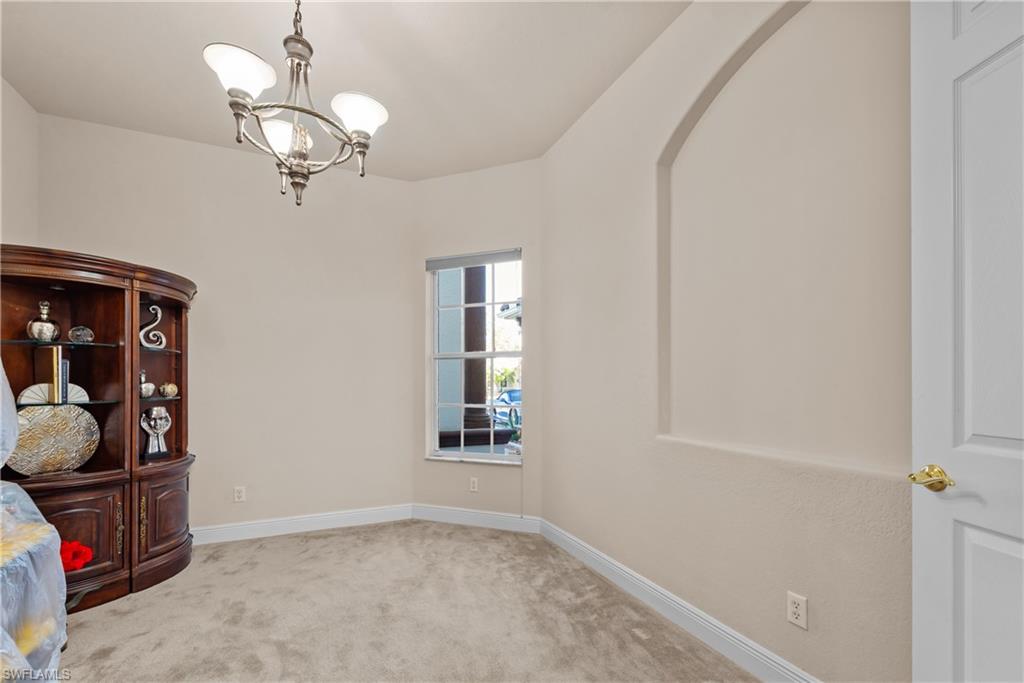 19261 La Serena Drive Estero, FL 33967 - Photo 20 of 48 a view of a room with racks on the wall