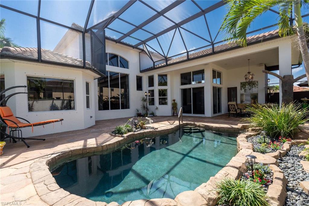 19261 La Serena Drive Estero, FL 33967 - Photo 2 of 48 a view of a house with backyard porch and sitting area