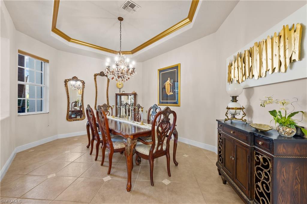 19261 La Serena Drive Estero, FL 33967 - Photo 21 of 48 a dining room with furniture and chandelier
