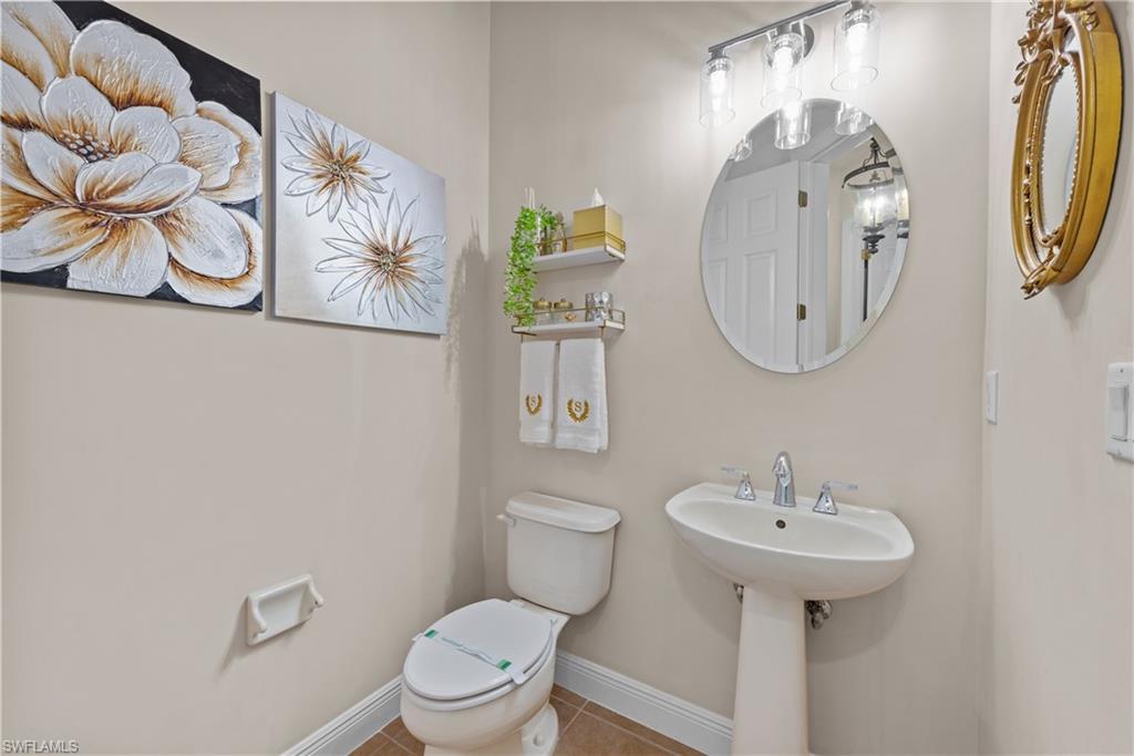 19261 La Serena Drive Estero, FL 33967 - Photo 36 of 48 a bathroom with a toilet sink and mirror