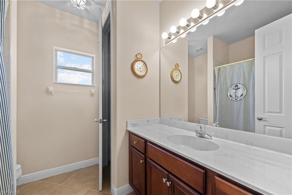 19261 La Serena Drive Estero, FL 33967 - Photo 41 of 48 a bathroom with a sink and a mirror