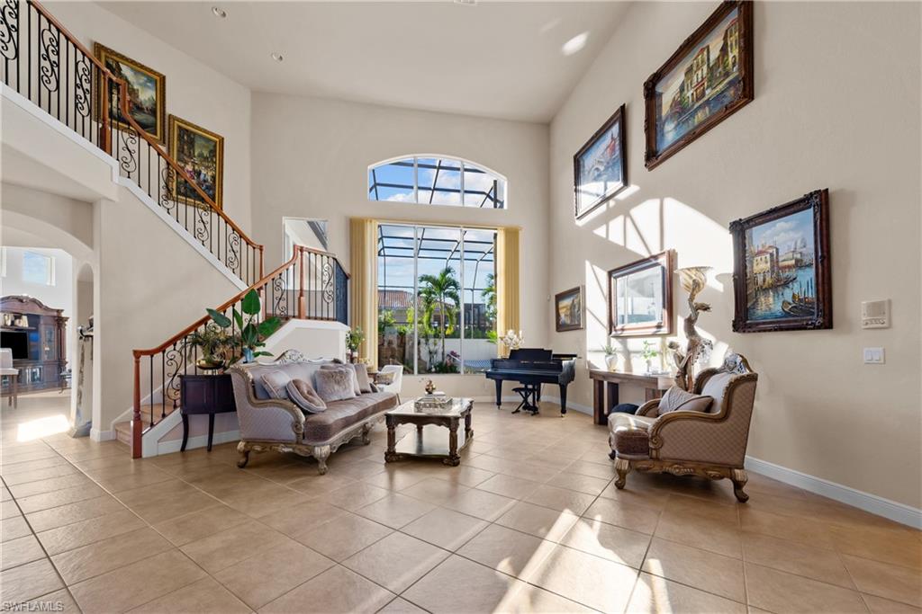 19261 La Serena Drive Estero, FL 33967 - Photo 7 of 48 a living room with furniture and a large window