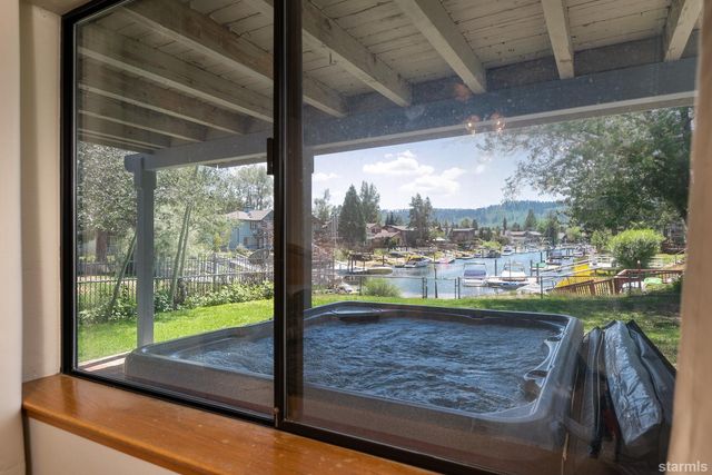 a room with view of lake view and a floor to ceiling window