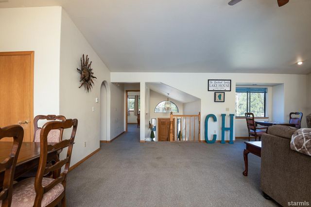 a view of a livingroom with furniture and windows