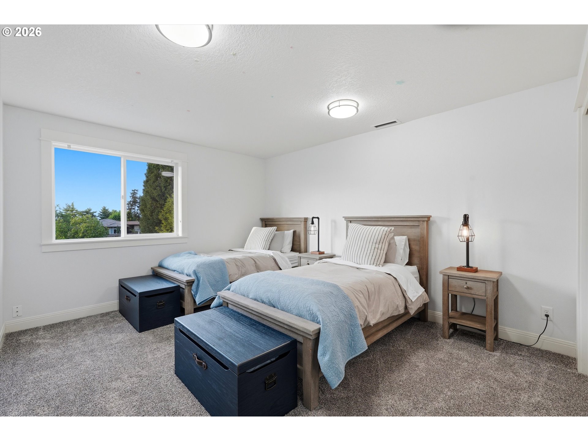 2923 Southwest 40th Street Gresham, OR 97080 - Photo 14 of 37 a bedroom with bed and window