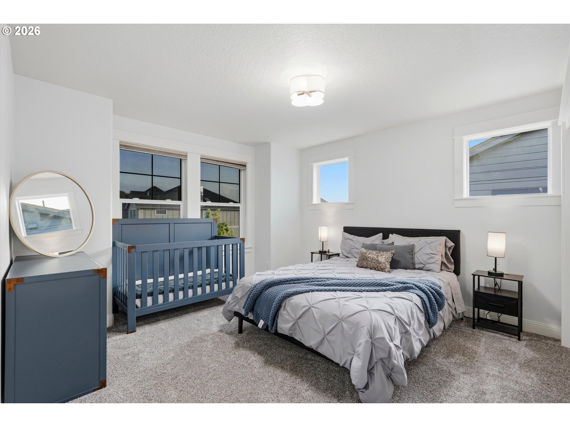2923 Southwest 40th Street Gresham, OR 97080 - Photo 16 of 37 a bedroom with a bed window and a table