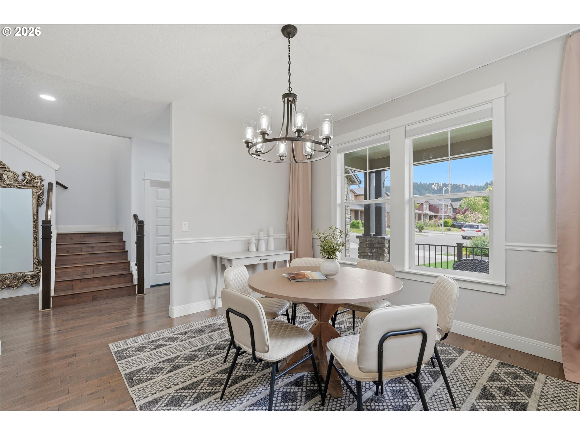 2923 Southwest 40th Street Gresham, OR 97080 - Photo 30 of 37 a dining room with furniture wooden floor and a chandelier