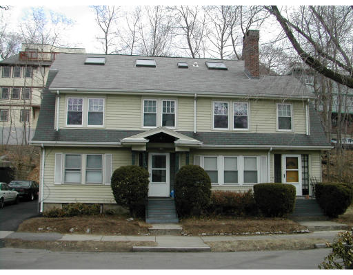 51 Beaconsfield Road, Unit 1 Brookline, MA 02445 - Photo 1 of 1 a front view of a house with yard and trees in the background
