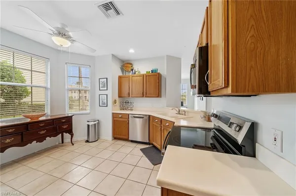 a kitchen that has a sink and chair