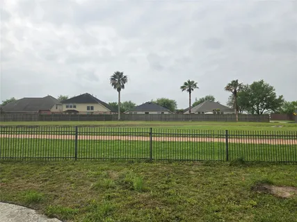 a view of a golf course with a lake