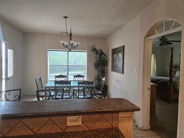 a dining room with furniture window and wooden floor