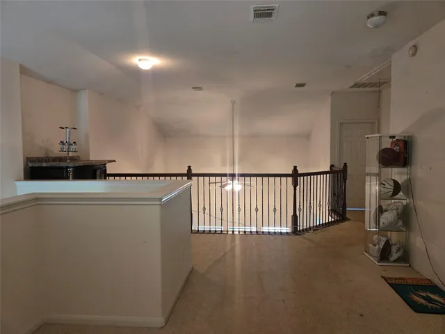 a view of a hallway with workspace