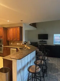 a kitchen with a dining table and chairs