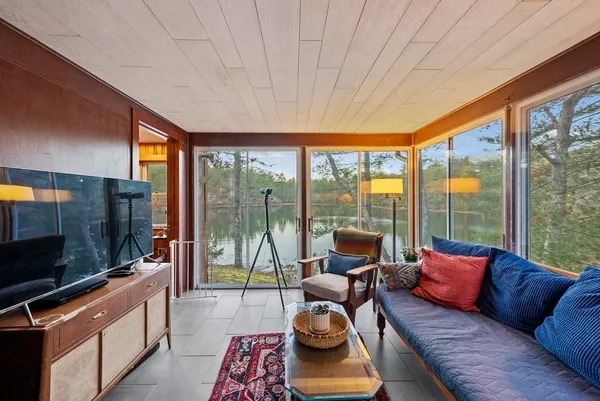 a living room with couch city view