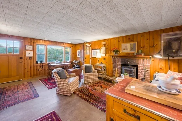 a bedroom with furniture and large windows