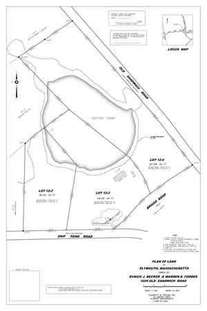 a view of a house with yard and sitting area