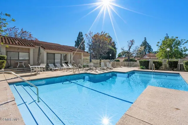 a view of a swimming pool with a patio