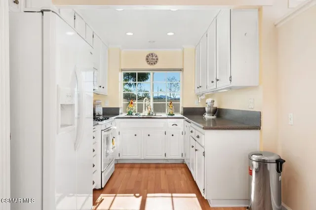a kitchen with cabinets a sink and a stove
