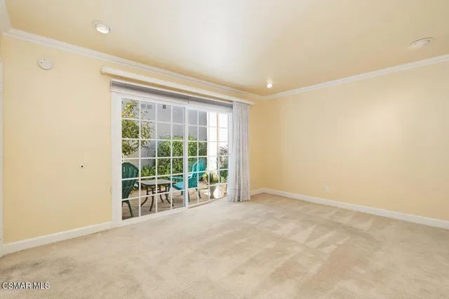 an empty room with floor to ceiling window and floor