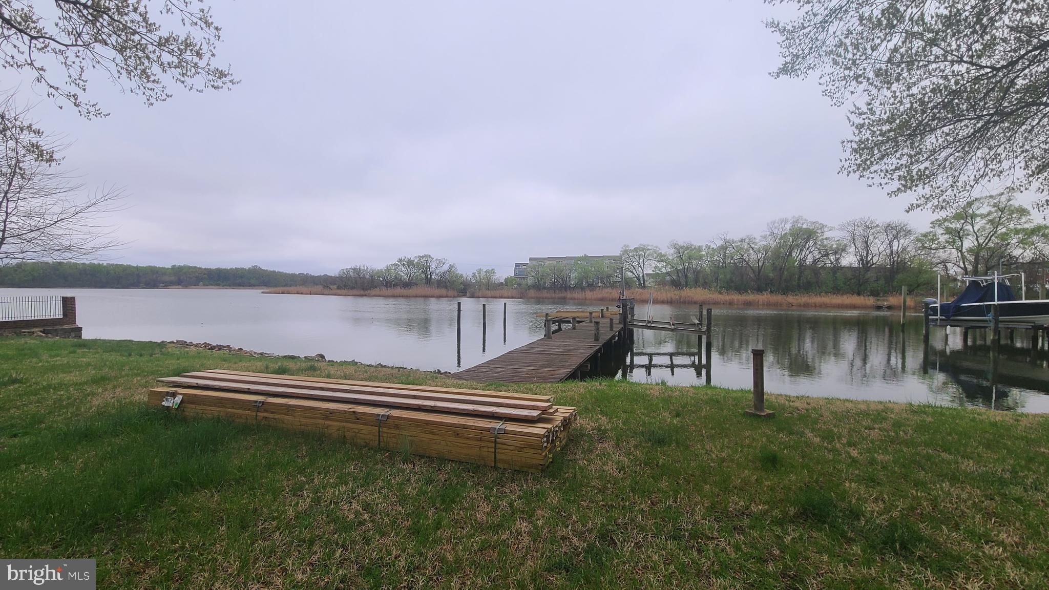 8644 Sandy Plains Road Dundalk, MD 21222 - Photo 6 of 19 a view of a lake with a house in the background
