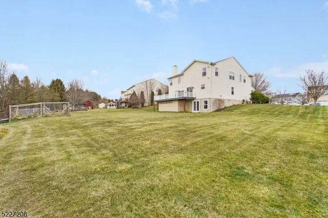 a view of a big room with table and chairs