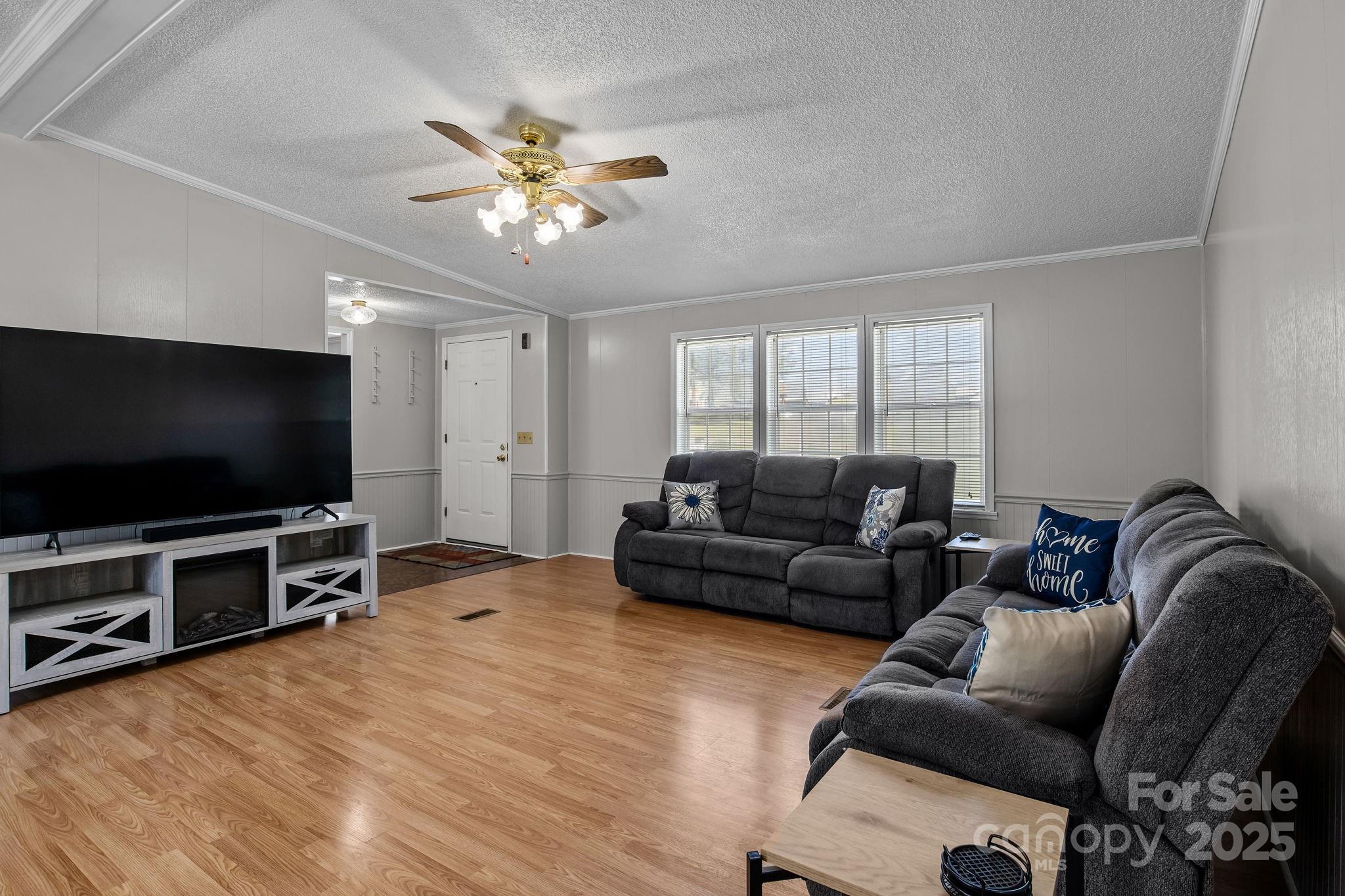 555 Fairmount Road Statesville, NC 28625 - Photo 11 of 48 a living room with furniture and a flat screen tv