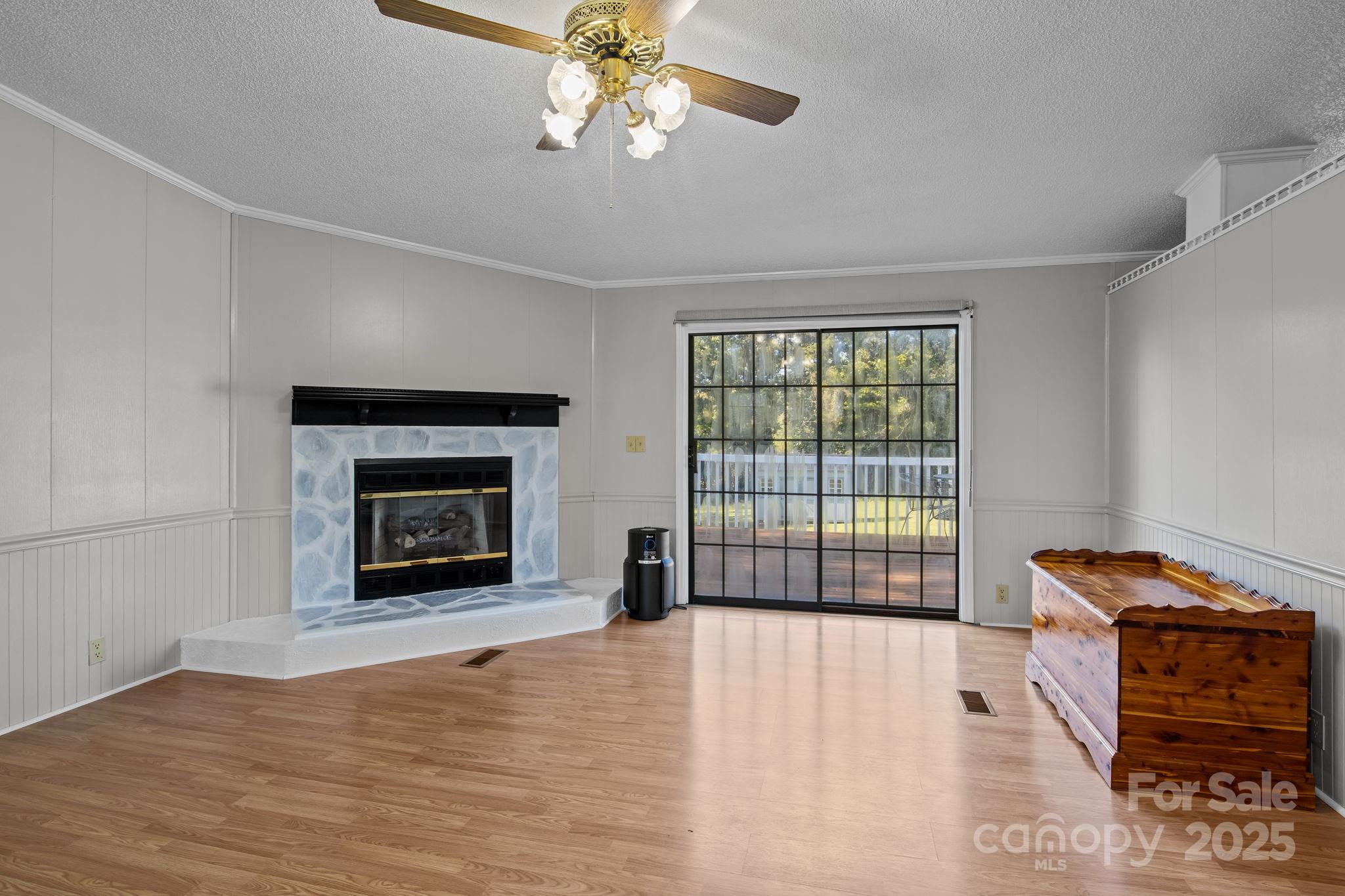 555 Fairmount Road Statesville, NC 28625 - Photo 12 of 48 a view of livingroom with furniture a fireplace and wooden floor