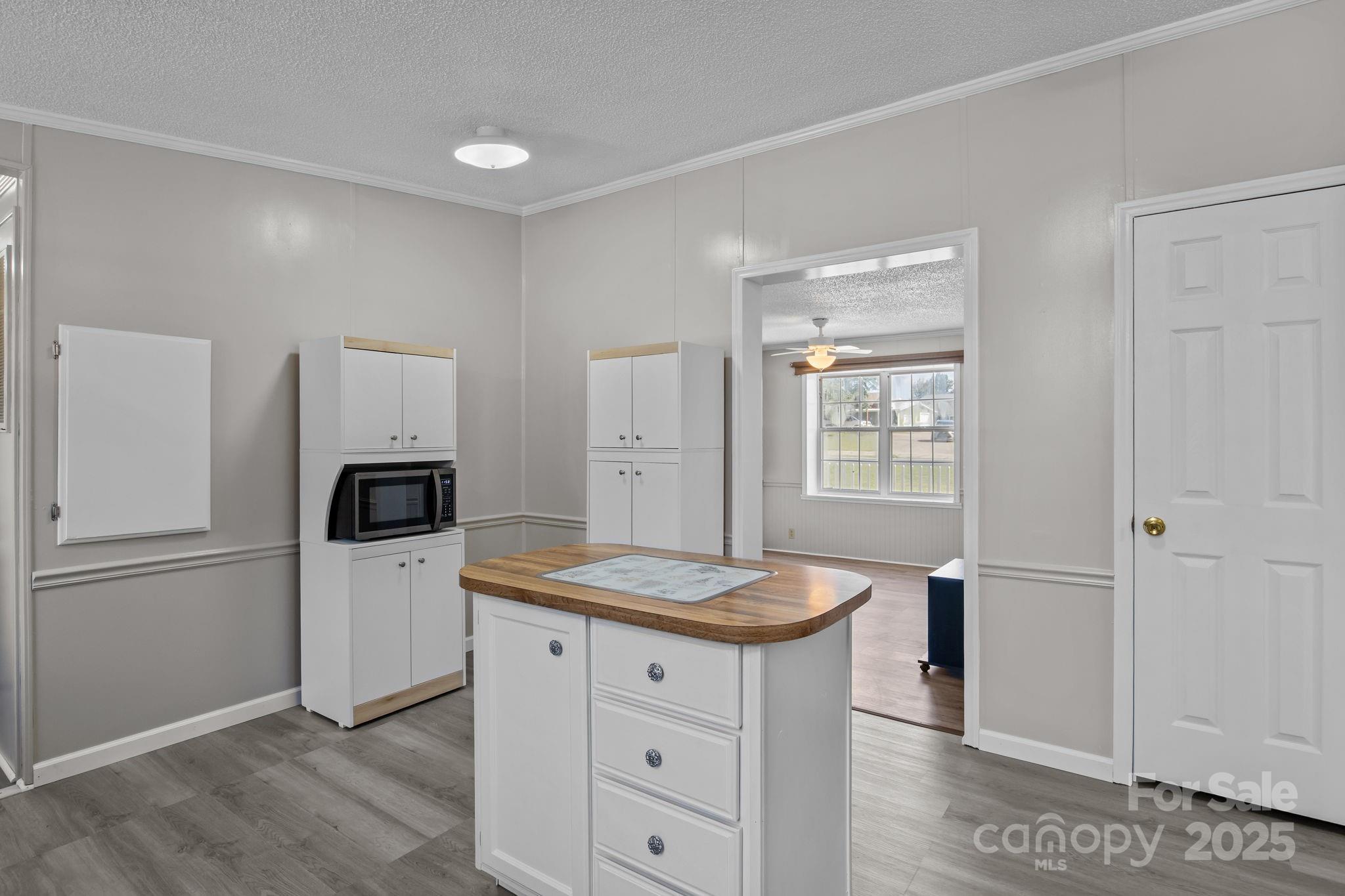 555 Fairmount Road Statesville, NC 28625 - Photo 20 of 48 a kitchen with a refrigerator and microwave