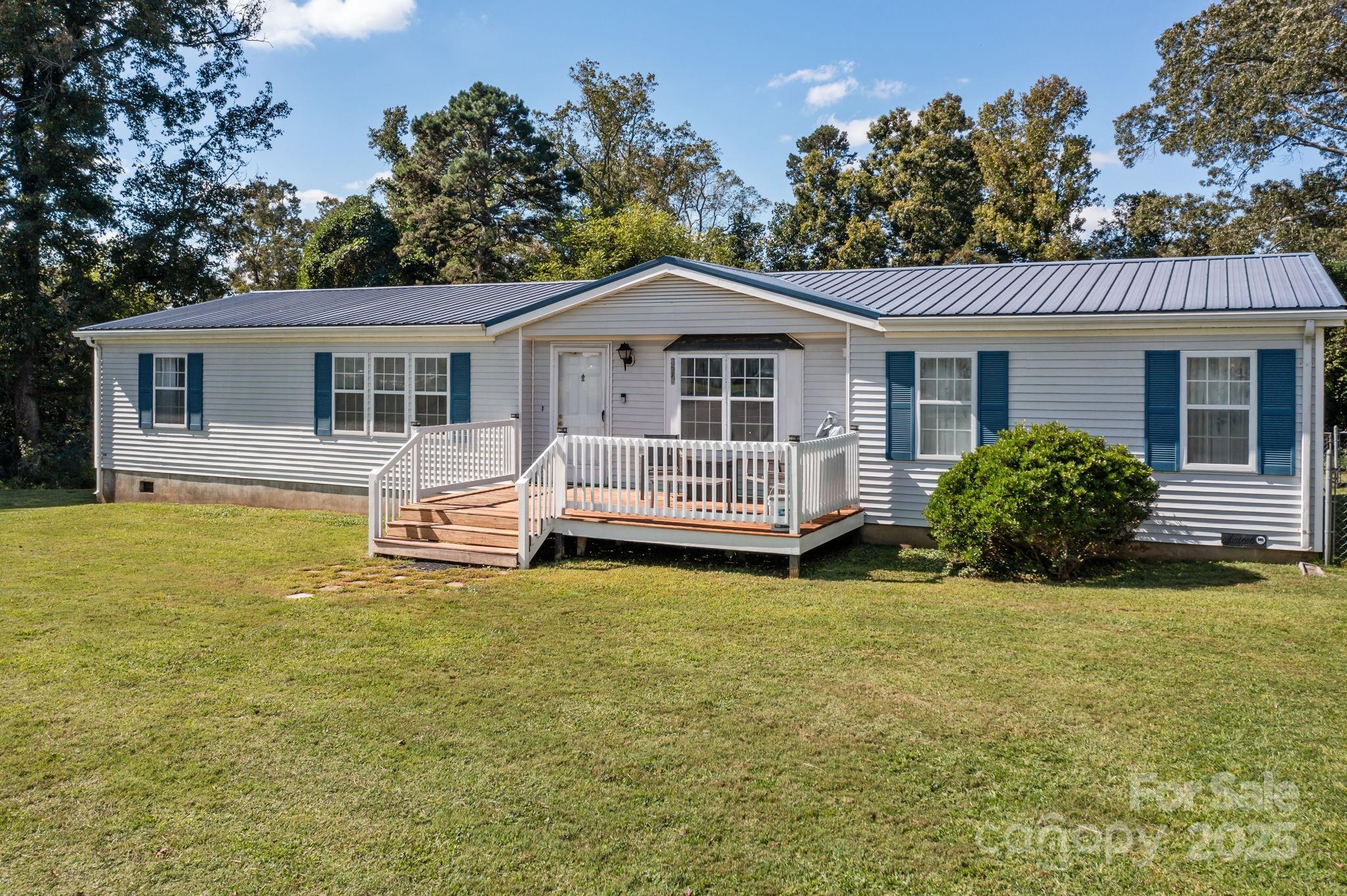 555 Fairmount Road Statesville, NC 28625 - Photo 2 of 48 a view of a house with a swimming pool