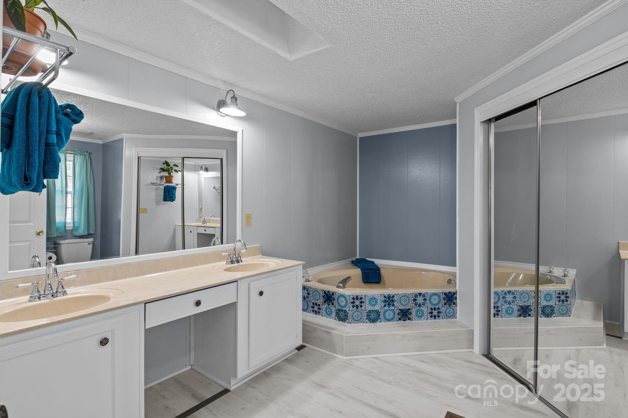 555 Fairmount Road Statesville, NC 28625 - Photo 25 of 48 a bathroom with a double vanity sink and a mirror