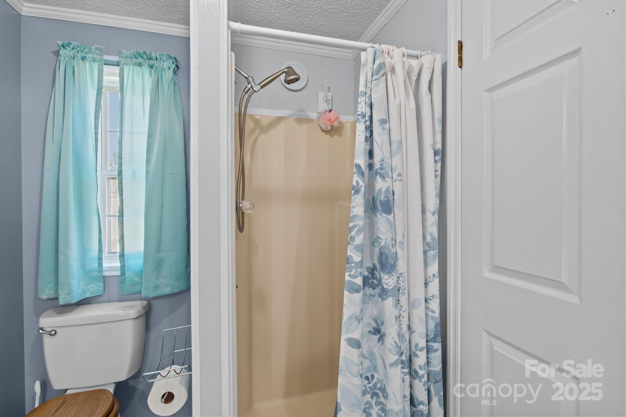 555 Fairmount Road Statesville, NC 28625 - Photo 27 of 48 a bathroom with a shower and a toilet