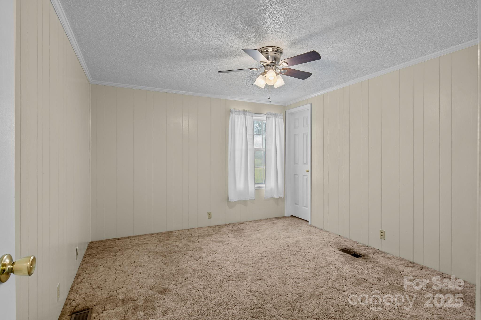 555 Fairmount Road Statesville, NC 28625 - Photo 29 of 48 a view of a big room with a chandelier fan and windows