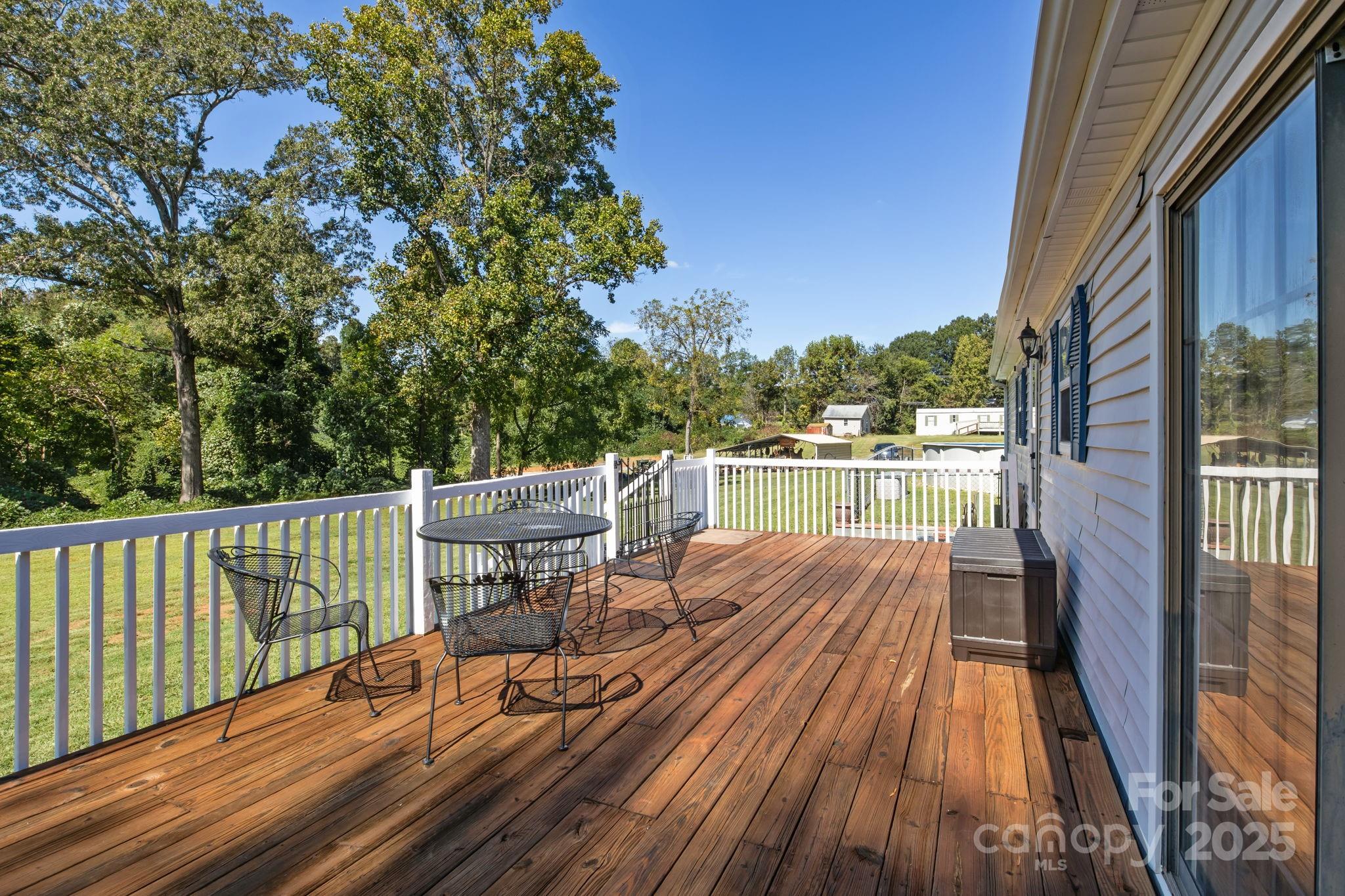555 Fairmount Road Statesville, NC 28625 - Photo 35 of 48 a view of balcony with wooden floor and seating space