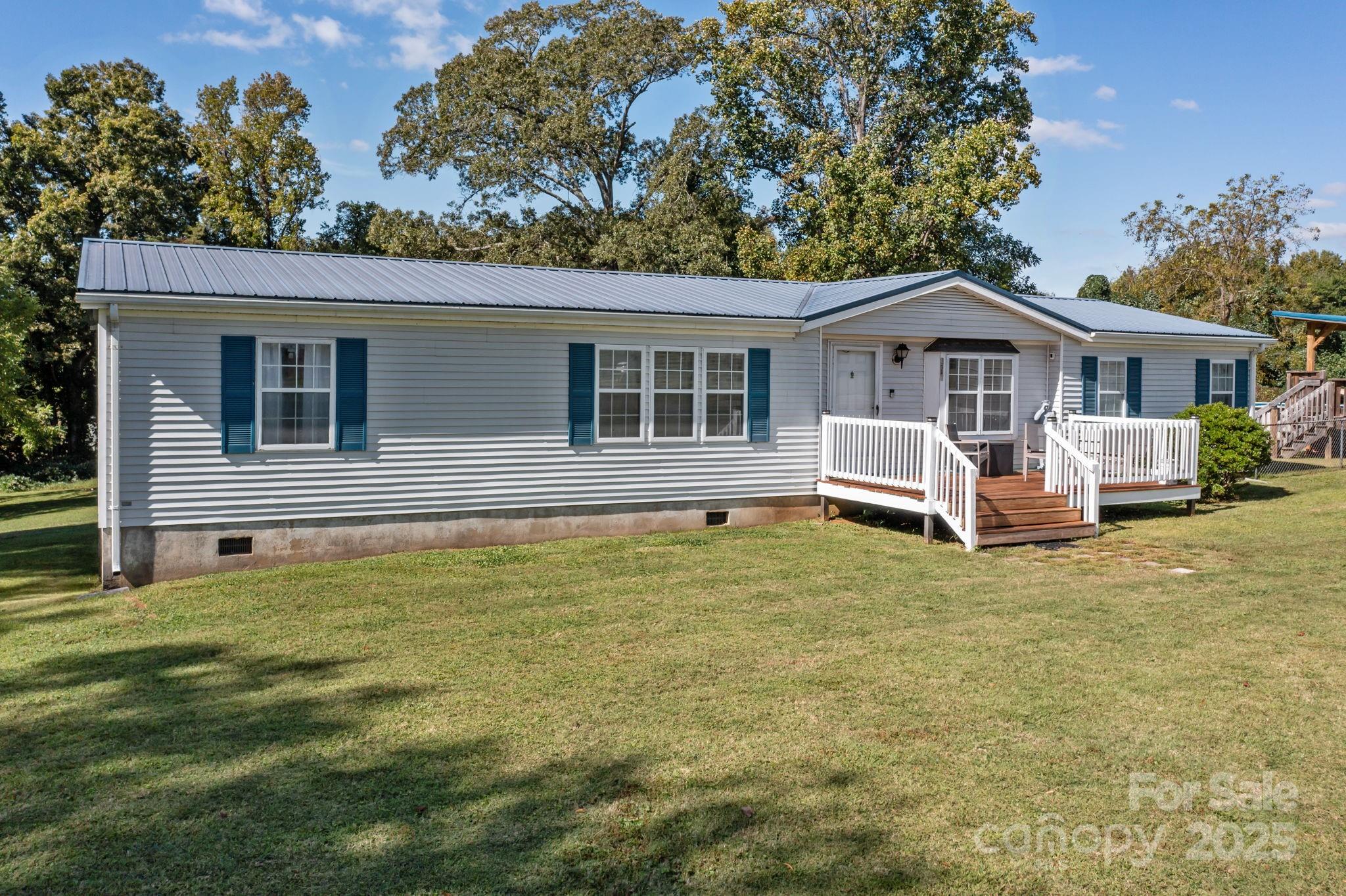 555 Fairmount Road Statesville, NC 28625 - Photo 4 of 48 a view of a house with a backyard