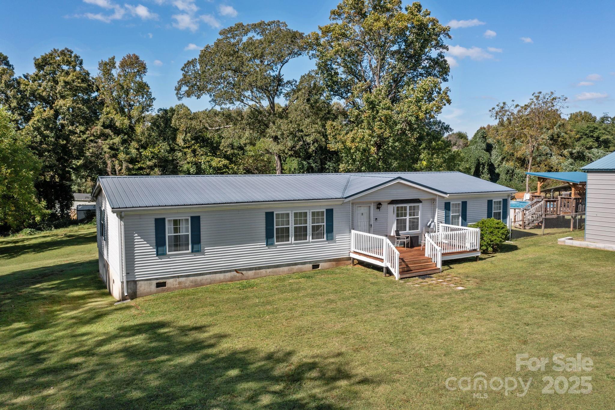555 Fairmount Road Statesville, NC 28625 - Photo 41 of 48 a view of a house with a yard