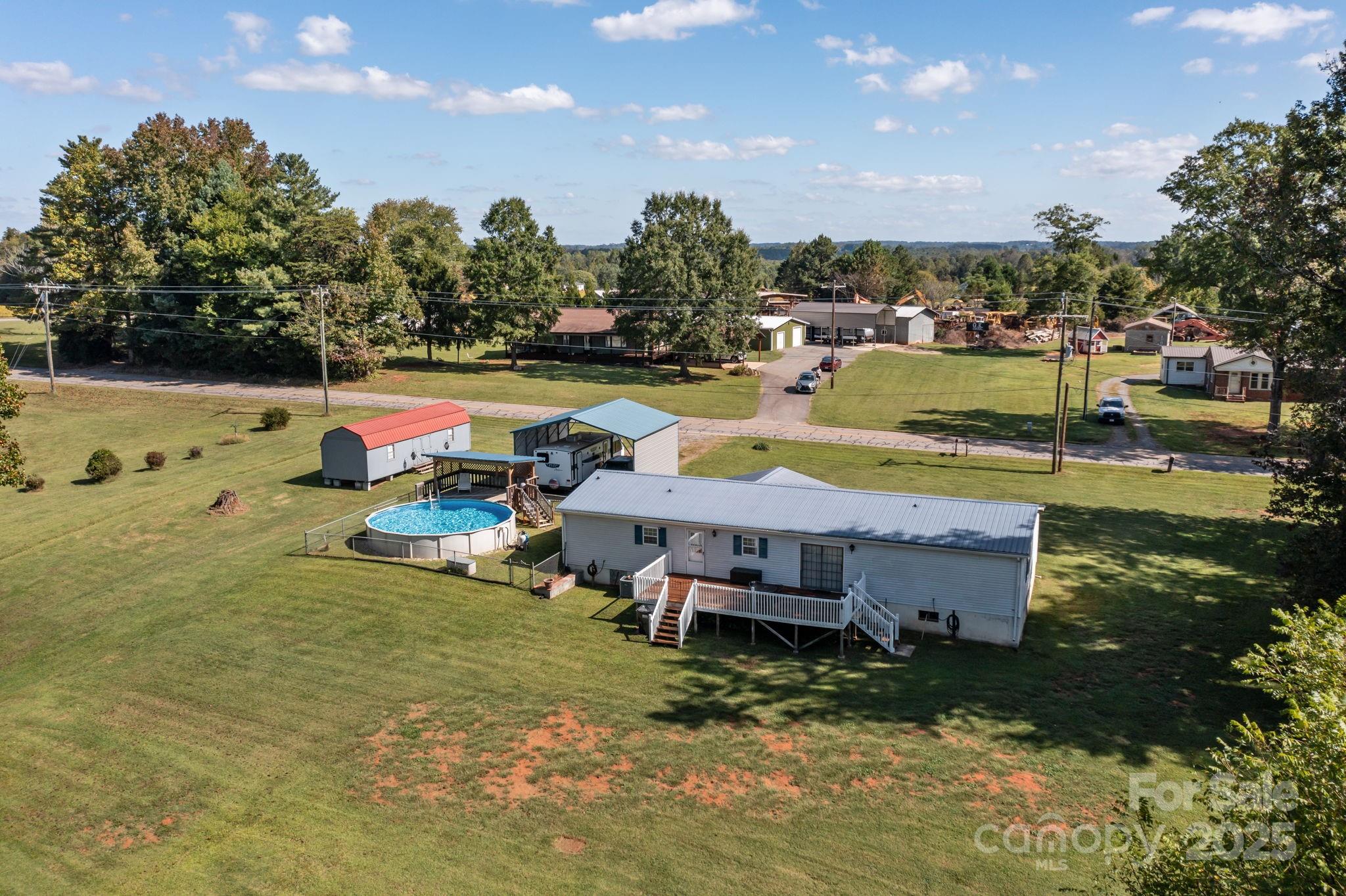 555 Fairmount Road Statesville, NC 28625 - Photo 45 of 48 a view of a swimming pool with a yard