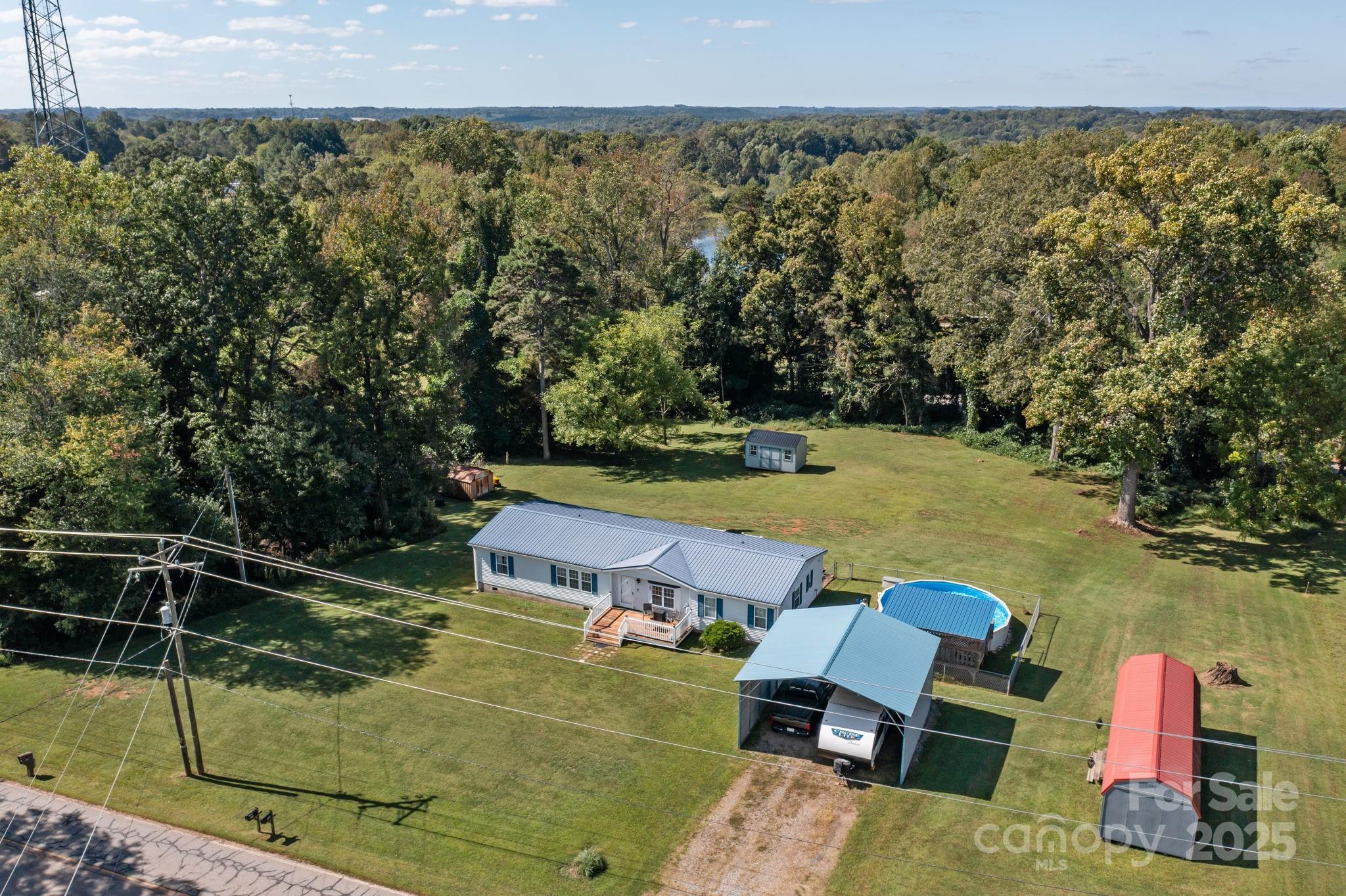 555 Fairmount Road Statesville, NC 28625 - Photo 47 of 48 a view of a swimming pool with a yard